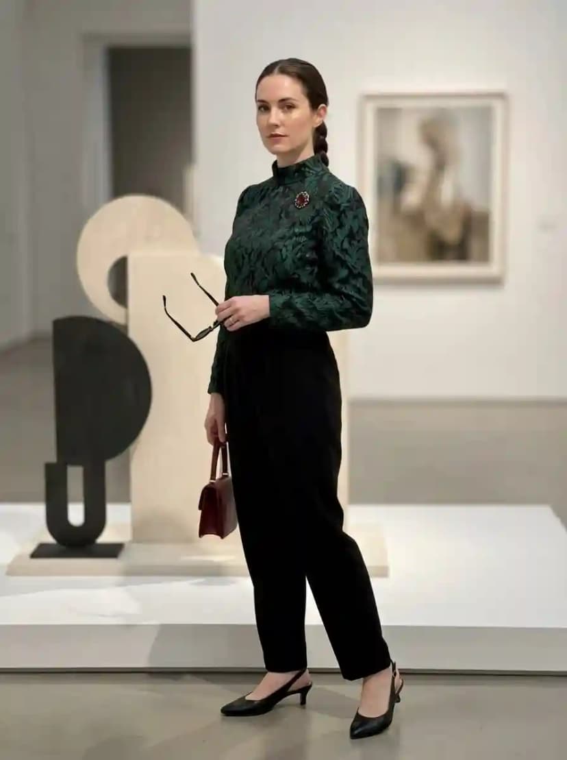 Dark green botanical print blouse, black tailored trousers, and black slingback kitten heels