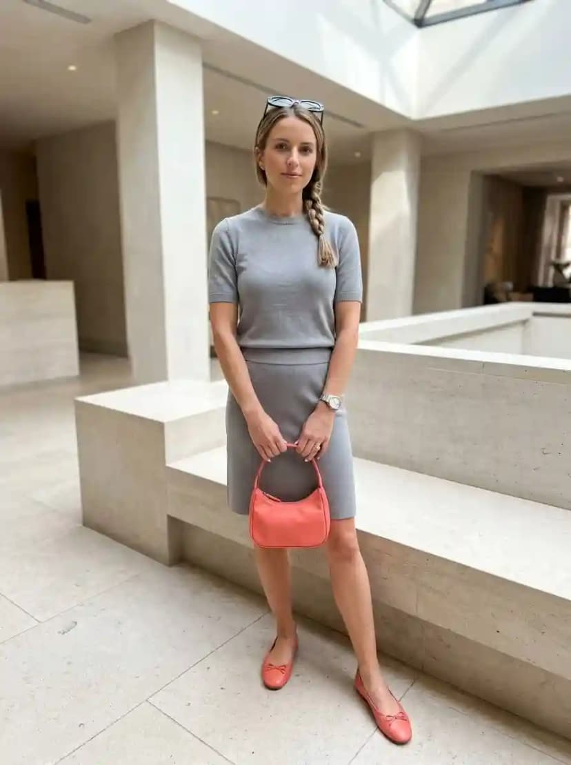 Light grey marl knit top, matching grey knit pencil skirt, and coral ballet flats