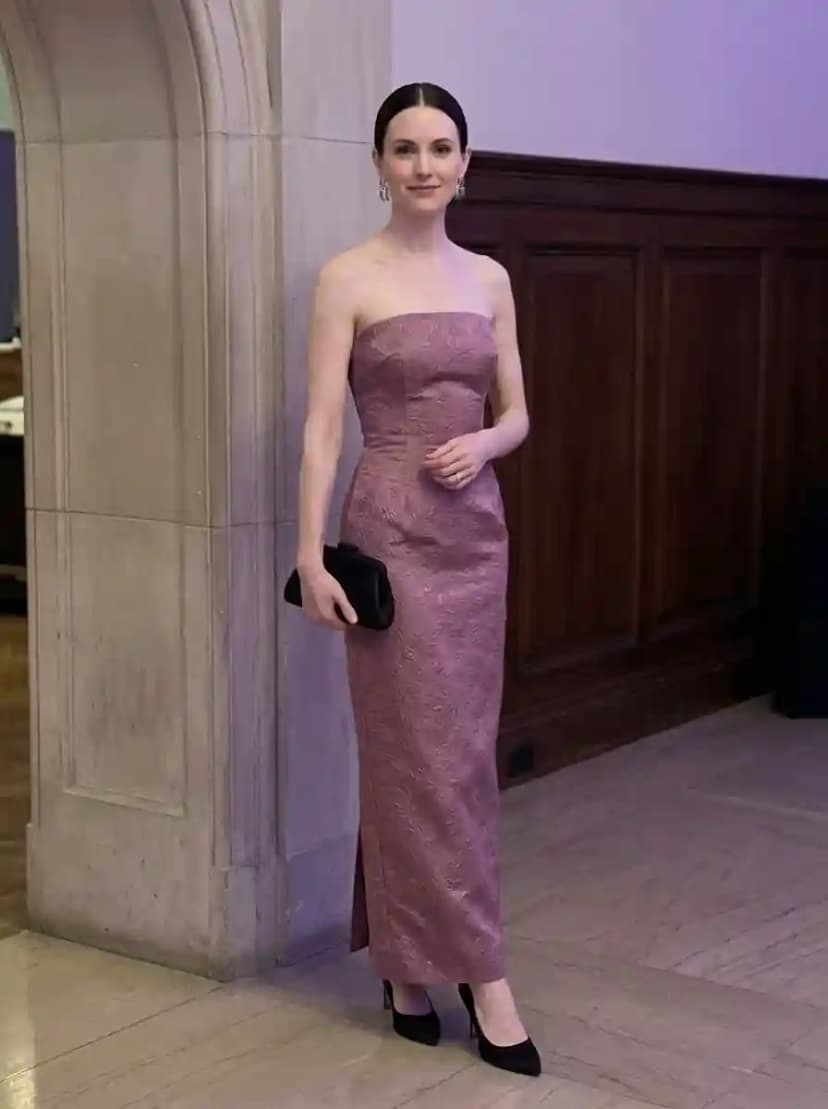 Dusty mauve strapless brocade column gown with black pointed-toe stiletto pumps