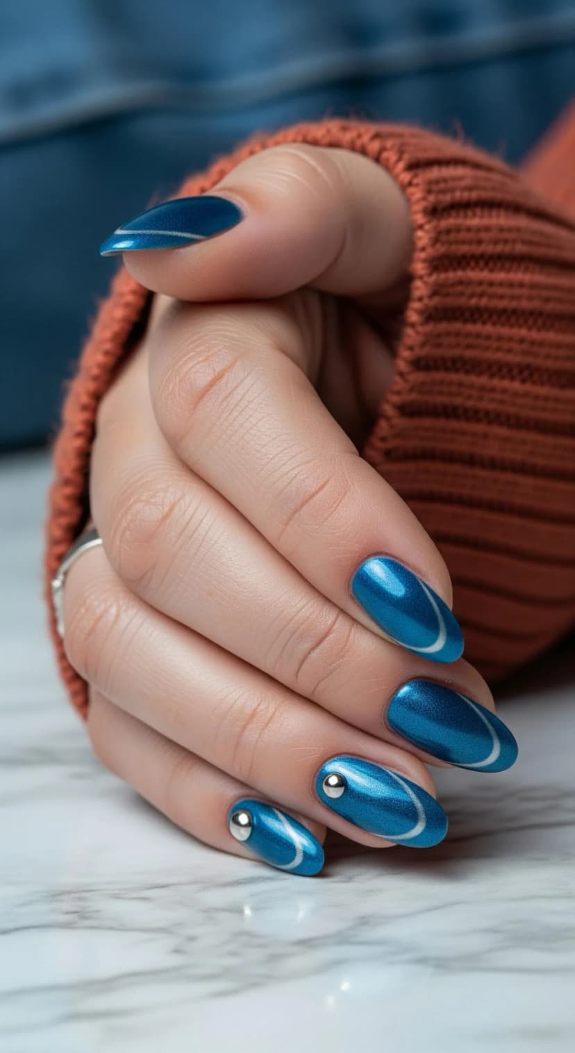 Blue Metallic Nails with Silver Swirls & Stud Accents
