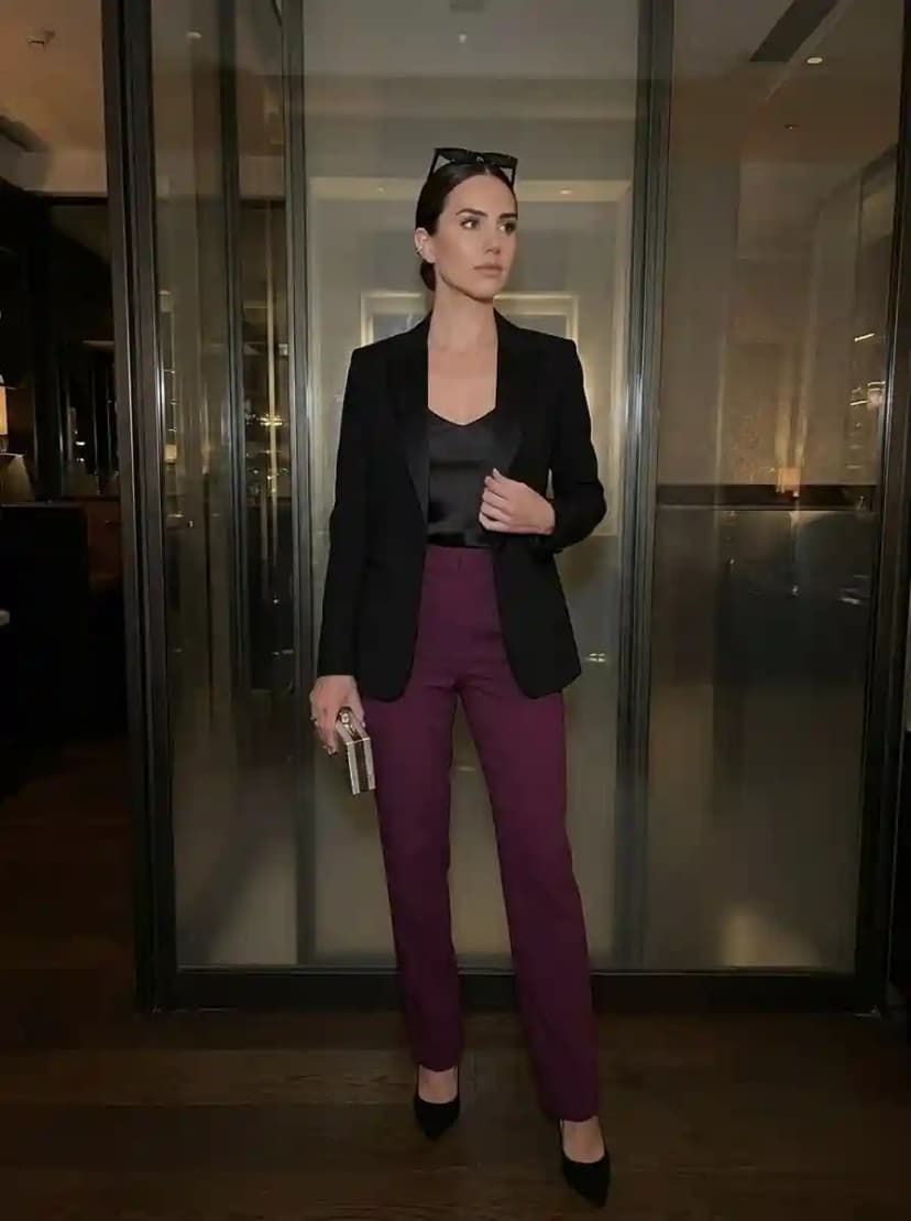 Black tuxedo blazer, black camisole, plum tailored trousers, and black pointed-toe pumps