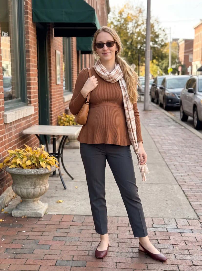 Brown ribbed peplum top, dark grey trousers, burgundy slingback flats, and plaid scarf