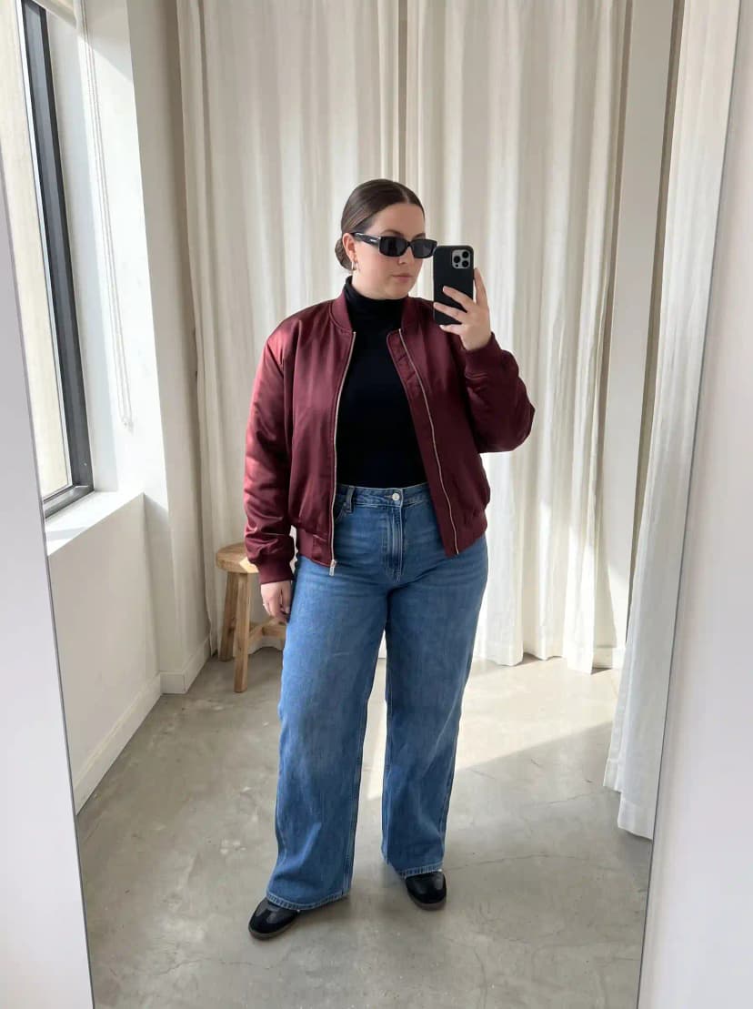 Burgundy Bomber Jacket + Black Turtleneck + Blue Jeans