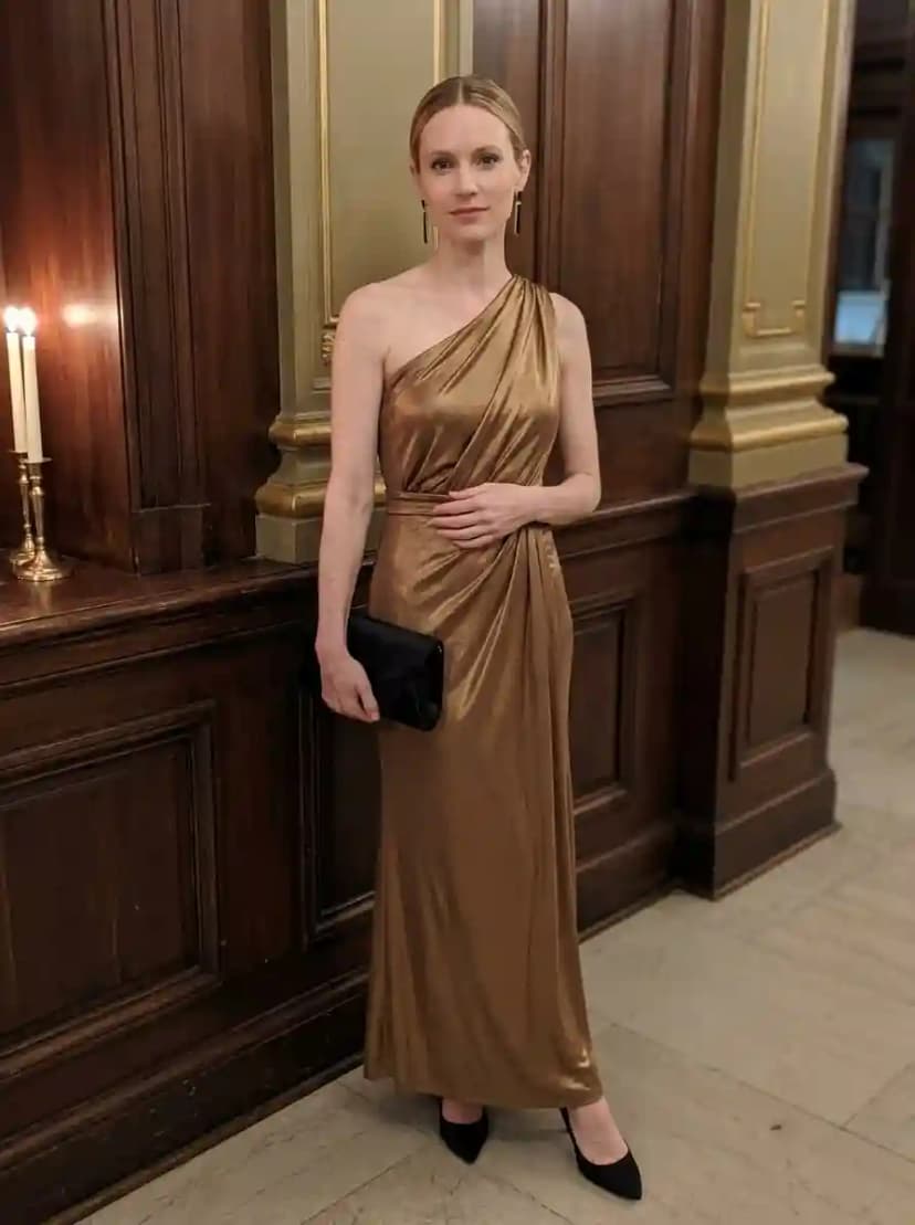 Antique gold one-shoulder metallic lamé floor-length gown with draped bodice