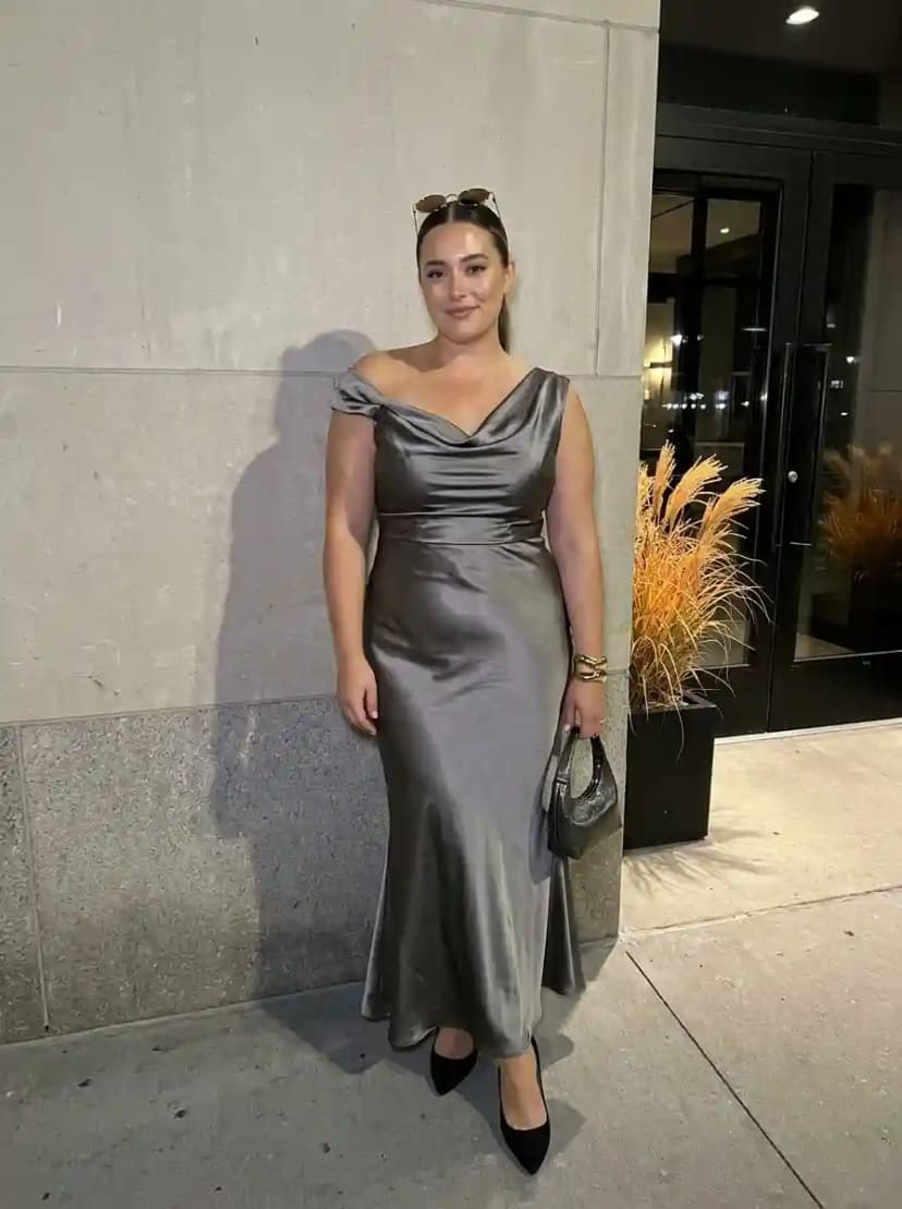 Pewter satin cowl-neck maxi dress with black pointed-toe pumps and gold cuff bracelet