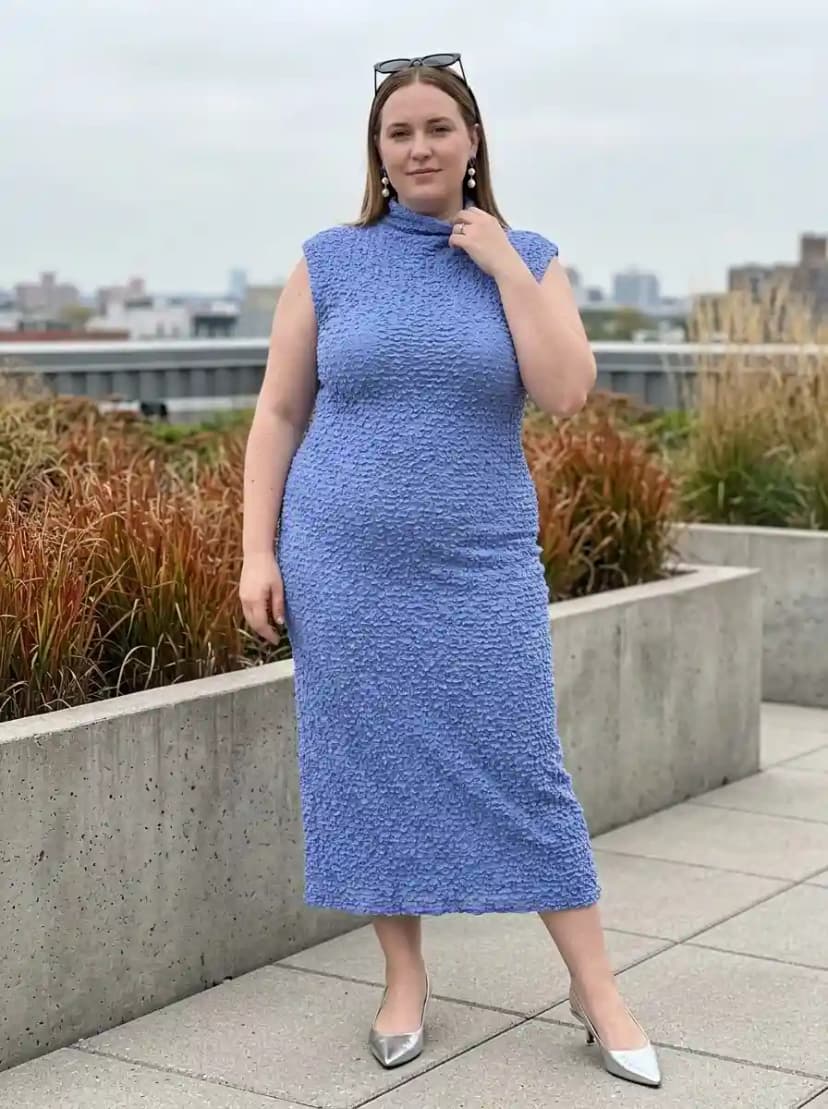 Periwinkle crinkled sleeveless sheath dress with metallic silver pointed-toe pumps