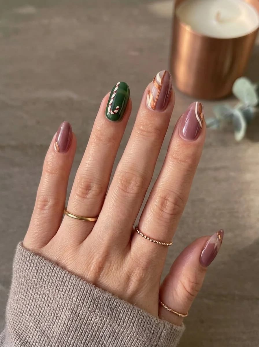 Mauve nails with green accent nail nude and white stripe accents