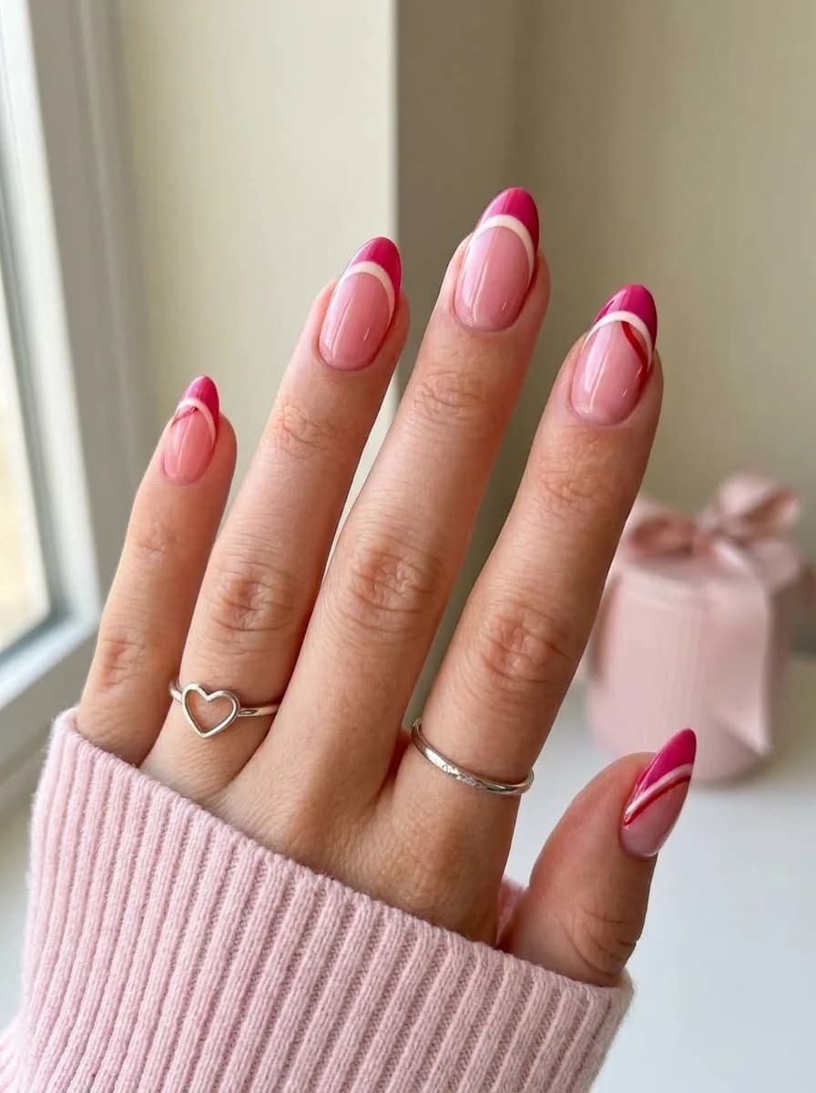 Nude nails with pink french tips pink and white stripe accents