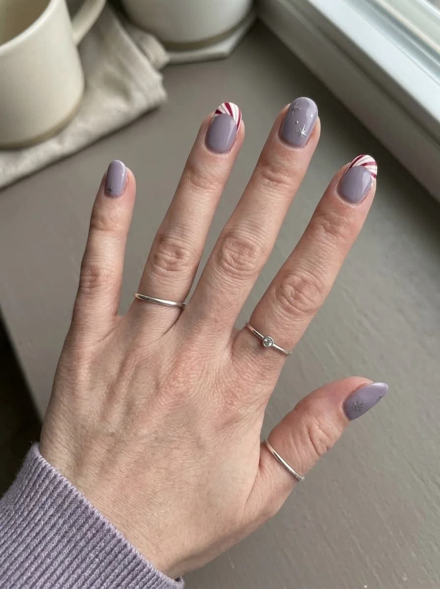 Lavender nails with red and white stripe accents and star accents
