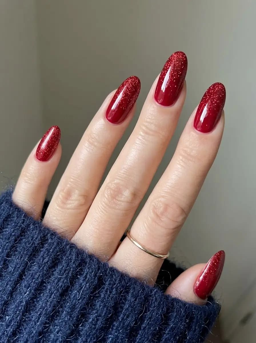 Ruby red glitter gradient Christmas nails with festive shimmering red ombre tips