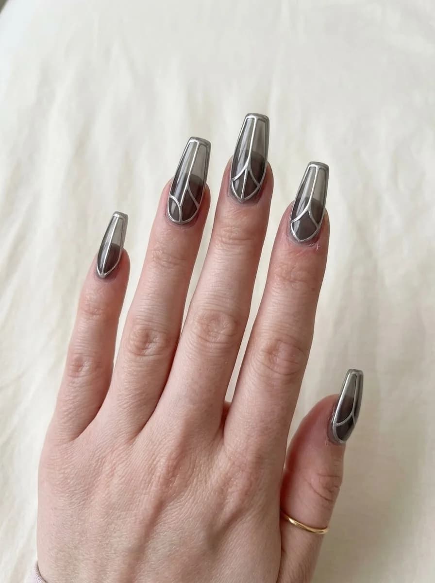 Short transparent smoky grey nails with fine silver-white curved geometric outline linework