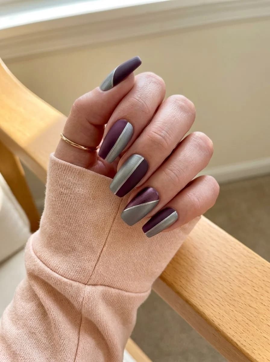 Long square matte plum purple nails with sharp diagonal metallic brushed silver color-blocking